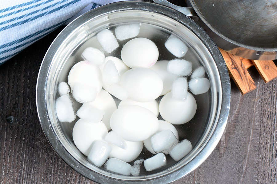 hard boiled eggs in an ice bath in a metal bowl so the egg shock and cool quickly.