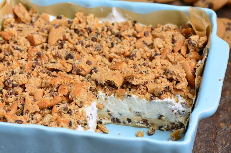 Cookie Dough No Bake Cheesecake in a pan with slice missing