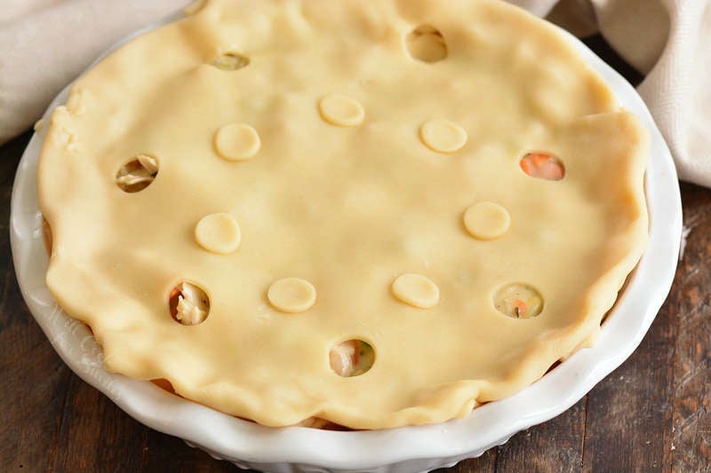 turkey pot pie before baking on a wood table