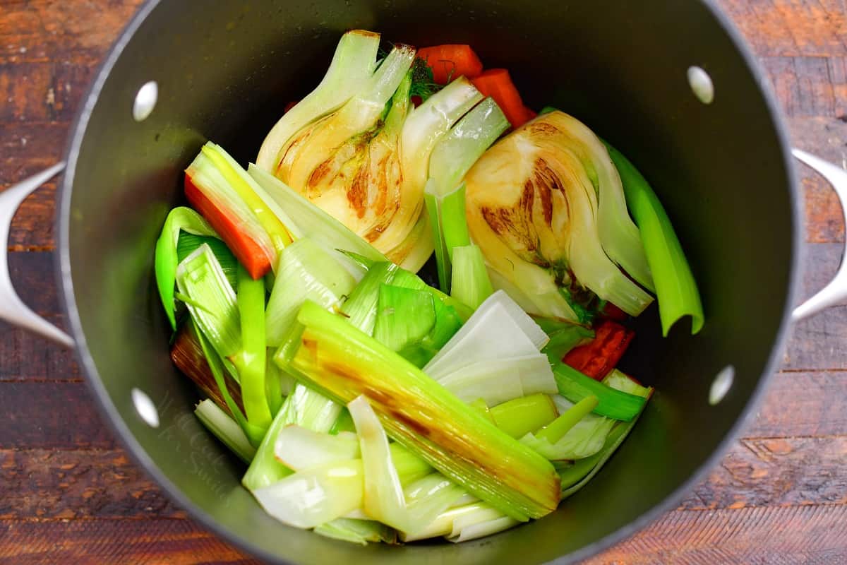 sauteed vegetables in large pot to make vegetable stock