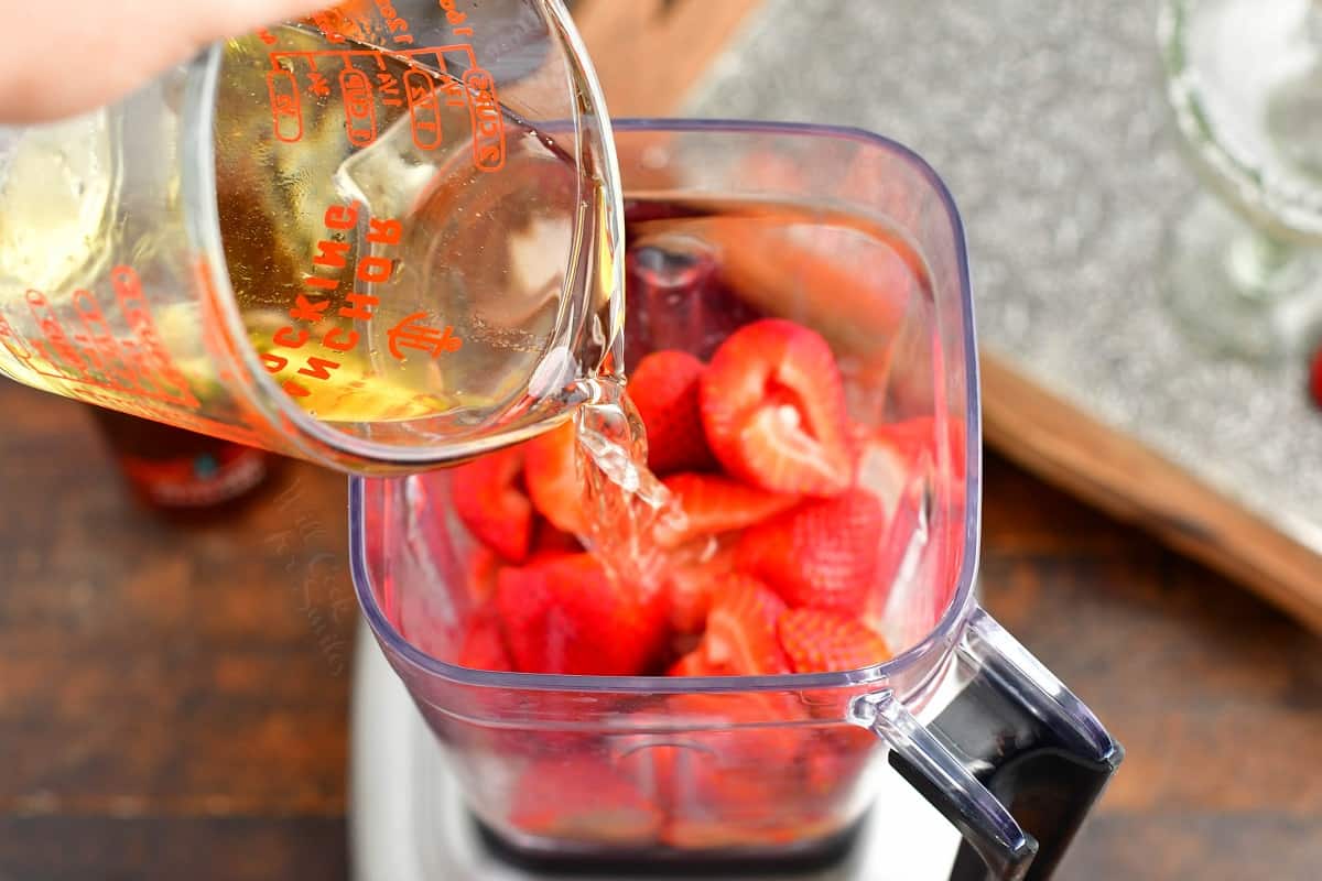 More ingredients are being added to the blender.