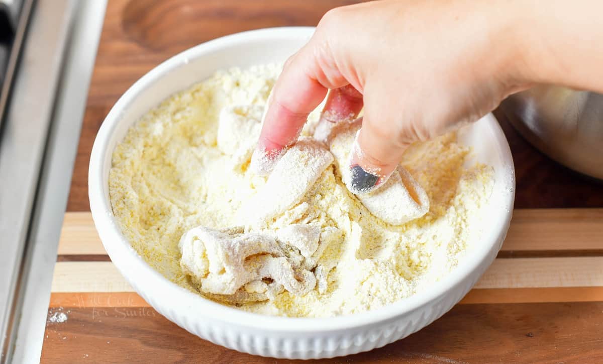 Squid is being dredged in a white bowl.