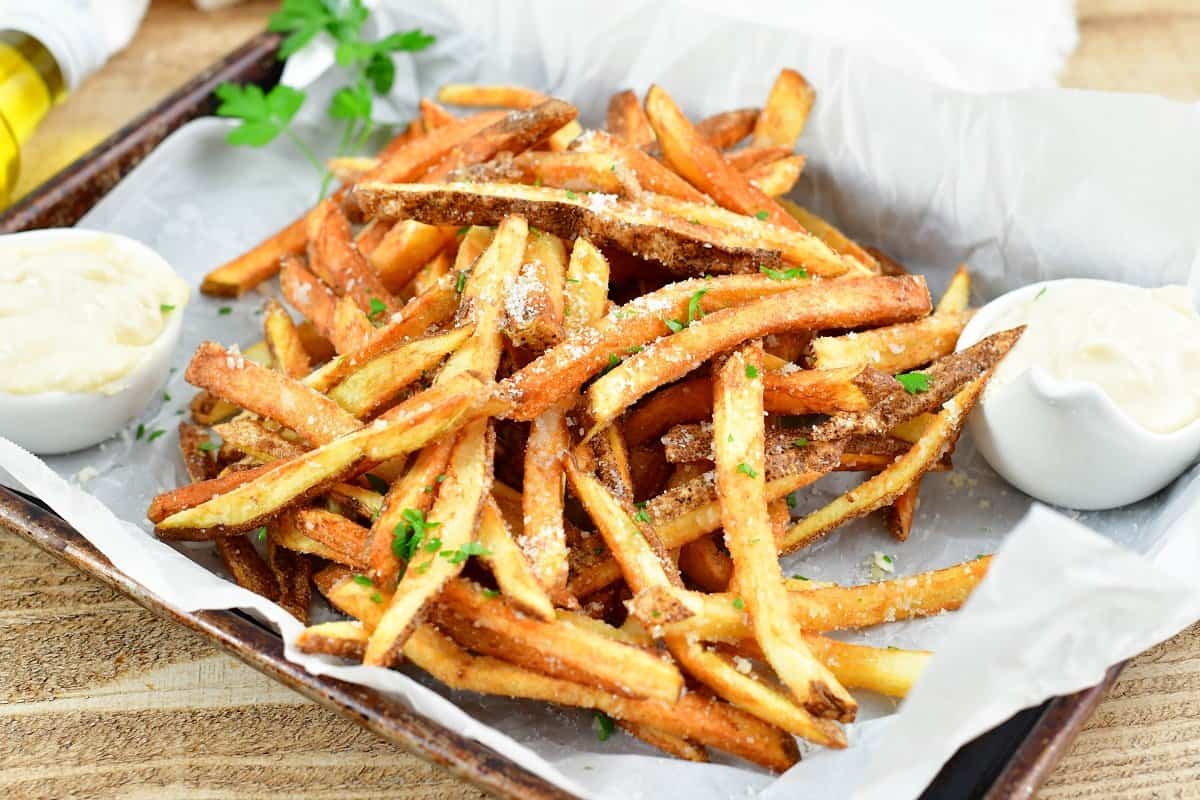 closeup of Parmesan coated truffle fries in parchment