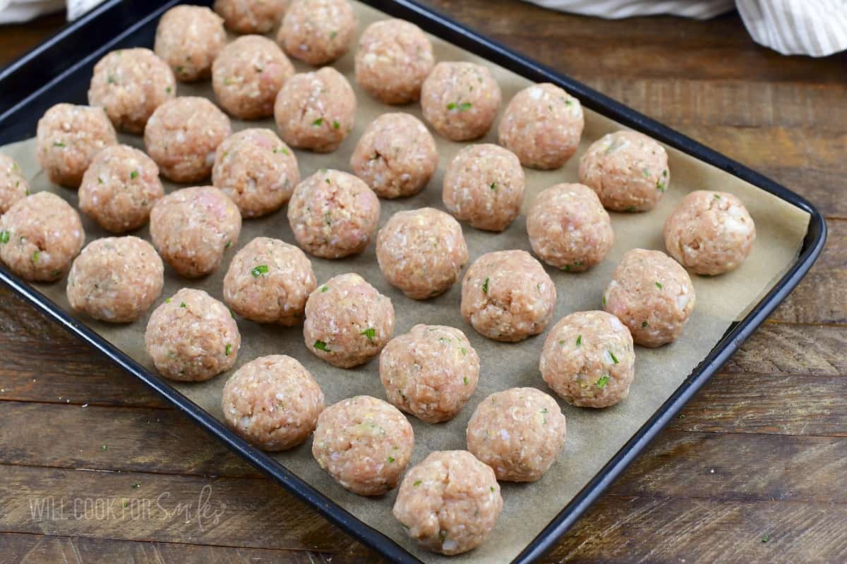 rolled turkey meatballs on the baking sheet.