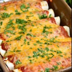 baked beef enchiladas topped with cilantro in a brown baking dish.