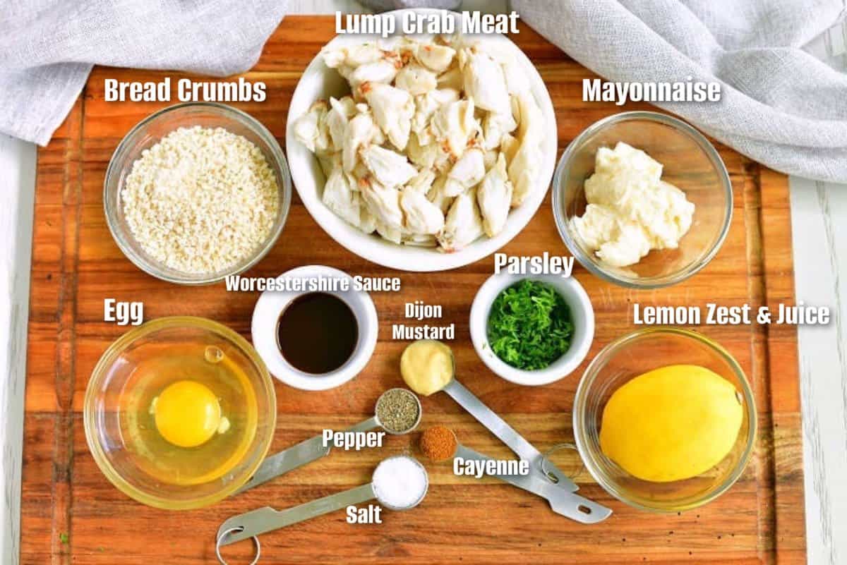 labeled ingredients to make crab cakes on the cutting board.