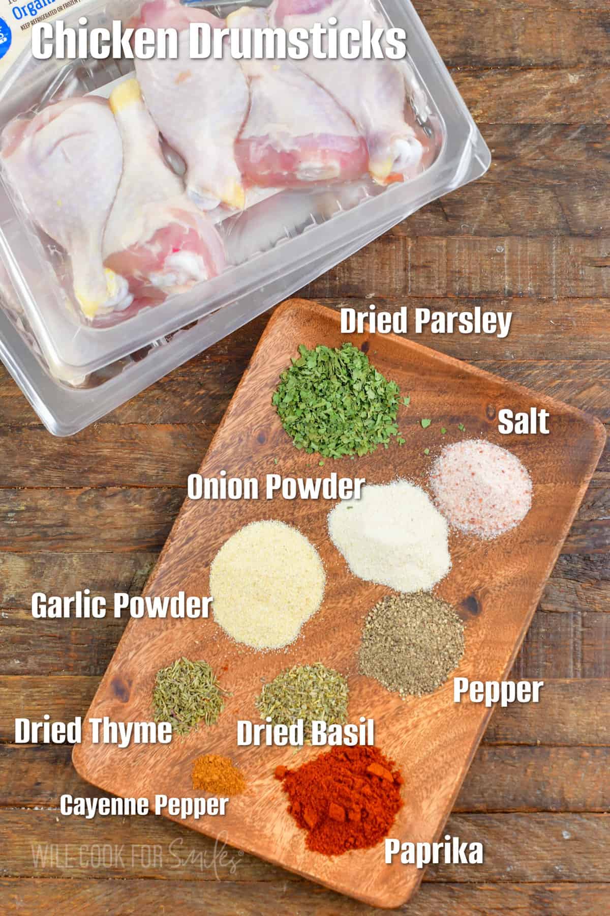 The ingredients for baked chicken drumsticks are placed on a wooden surface.