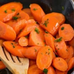 starting to stir some honey glazed carrots in the skillet.