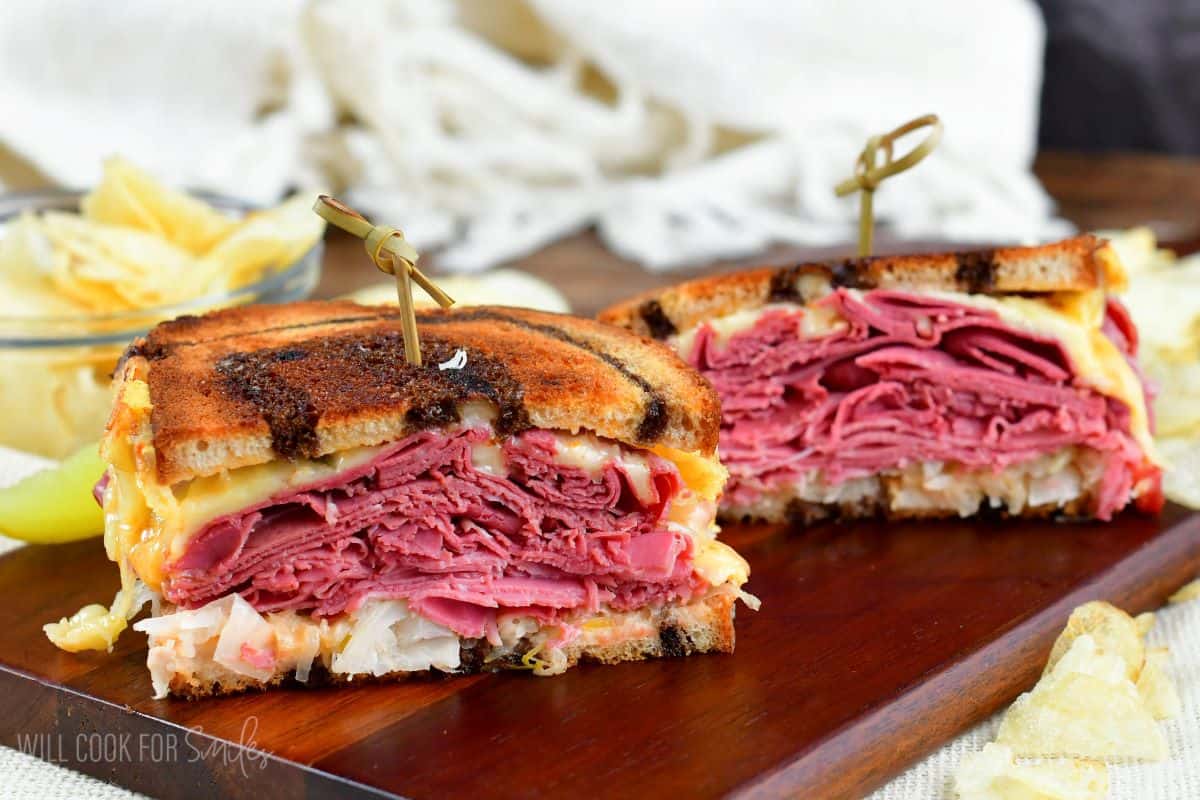 a halved sandwich is pierced with toothpicks