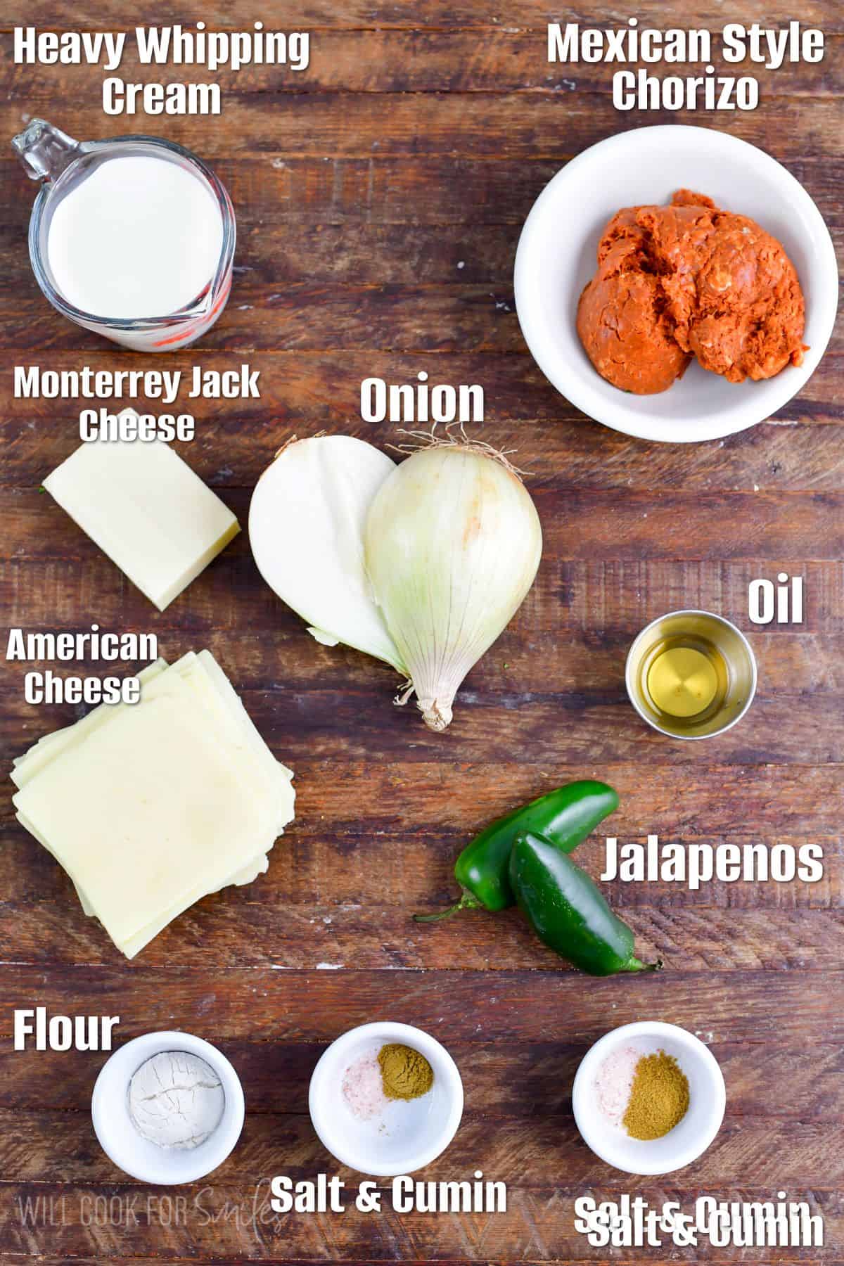 labeled ingredients to make queso blanco with chorizo on top of wooden table.