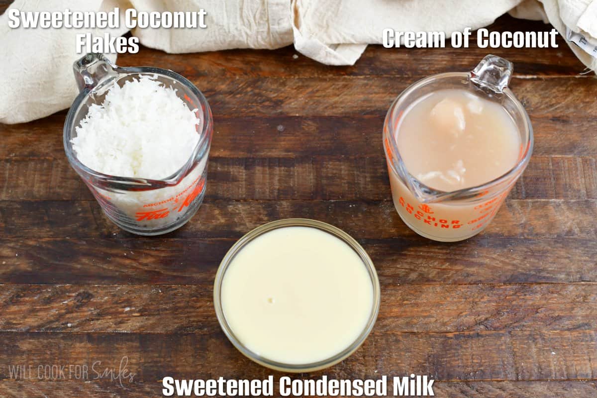 labeled ingredients for coconut syrup on a wood surface.