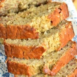 The top of sliced coconut banana bread fanned out on a tea towel.