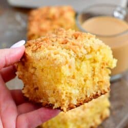 Holding a slice of coconut coffee cake in my hand.