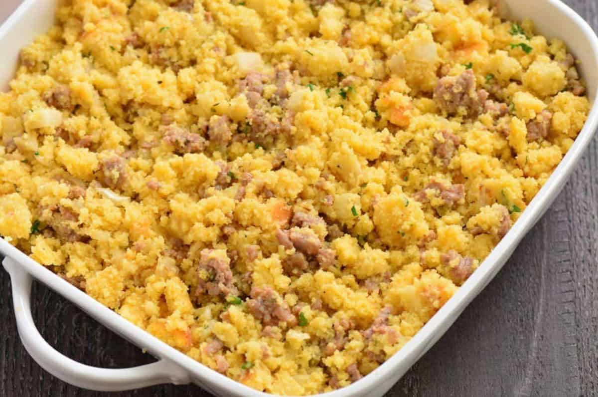 uncooked sausage cornbread dressing in the baking dish.