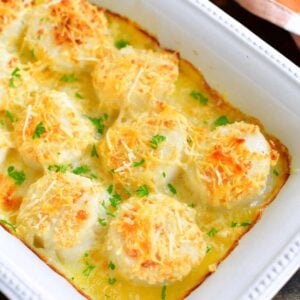 baked scallops topped with parmesan and cooked in butter in the baking dish.