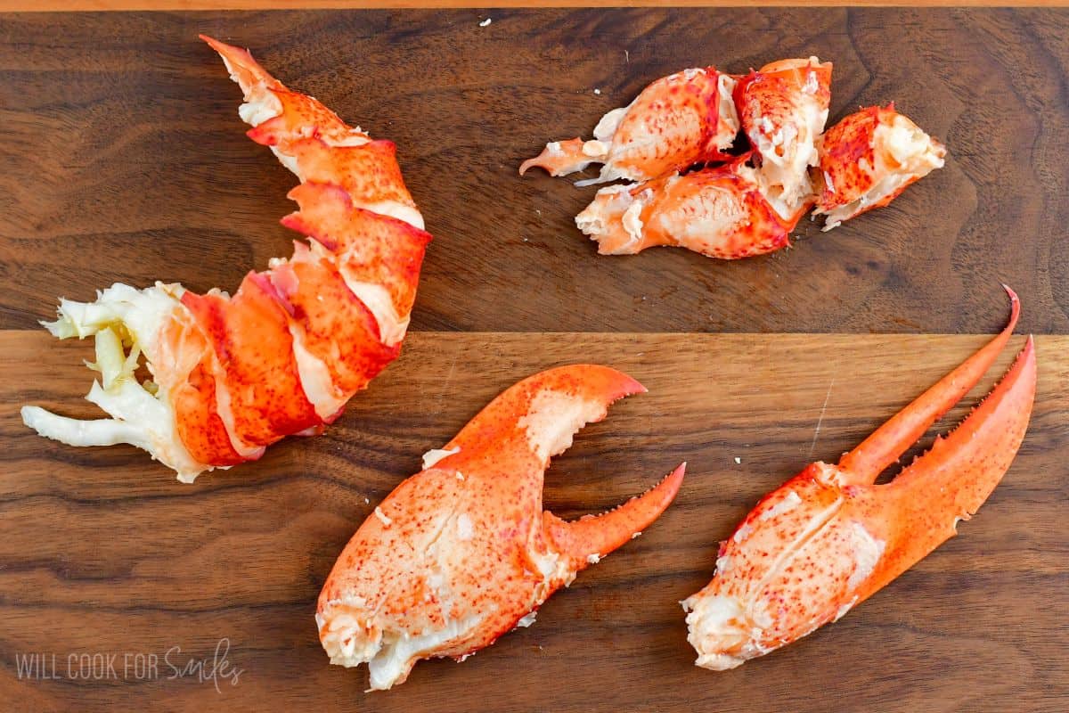 lobster meat from tail and claws on the cutting board.