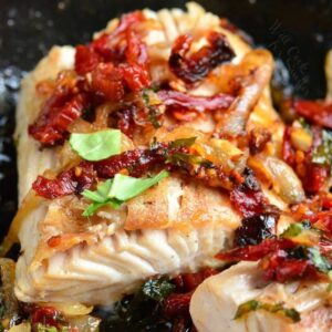 a thick juicy mahi mahi filet pan seared with sun dried tomato and basil topping.