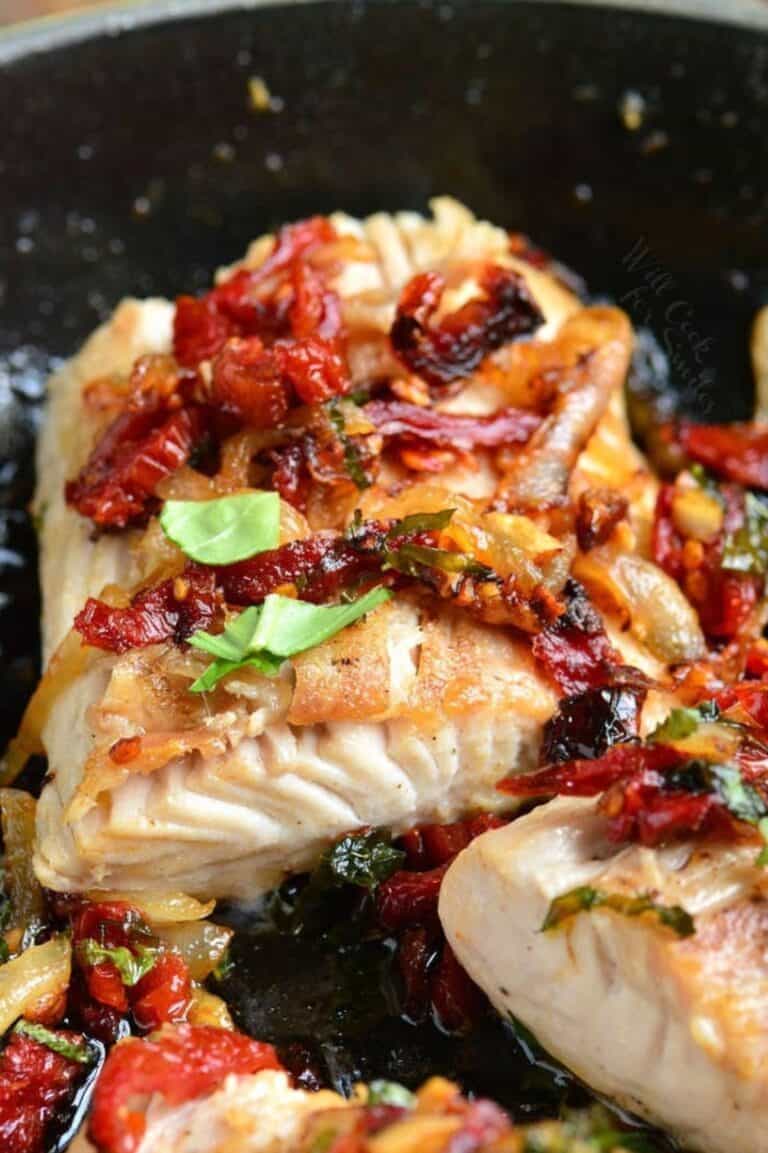 a thick juicy mahi mahi filet pan seared with sun dried tomato and basil topping.
