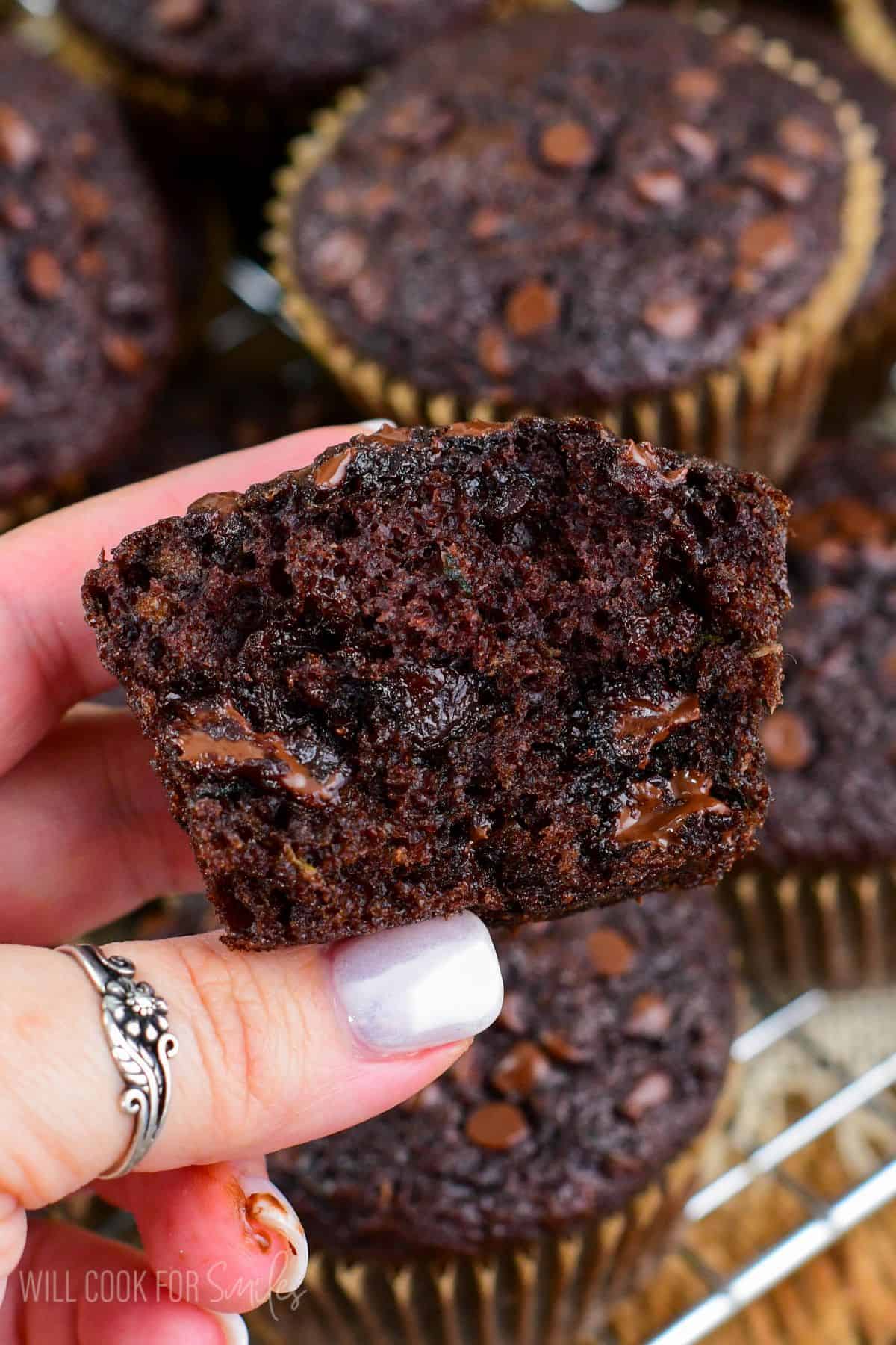 holding a muffin in my hand that has been cut in half.