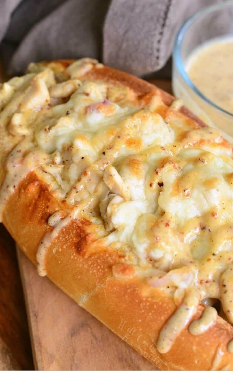 toasted sub sandwich with chicken, and melted cheese, and drizzled with white BBQ sauce.