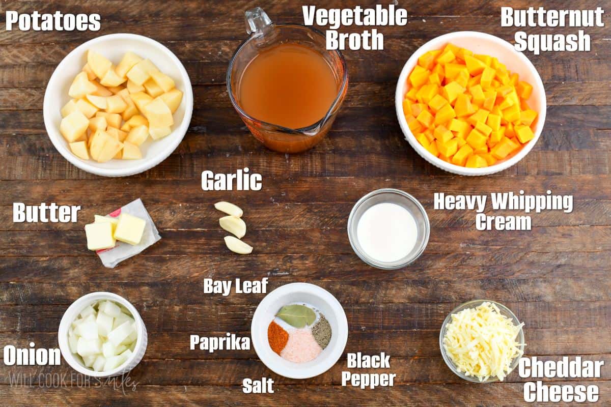 labeled ingredients for butternut squash potato soup on a wooden board.