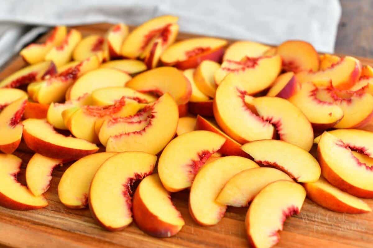 sliced peaches on the cutting board.