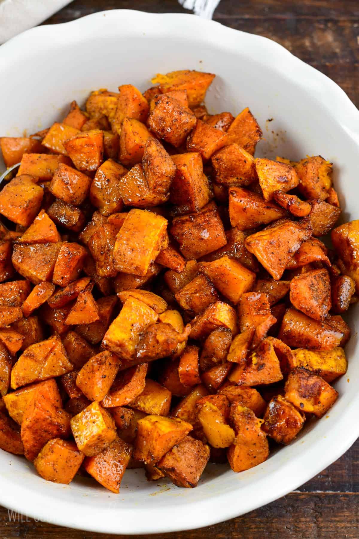 Cooked spiced roasted honeynut squash in a large bowl.