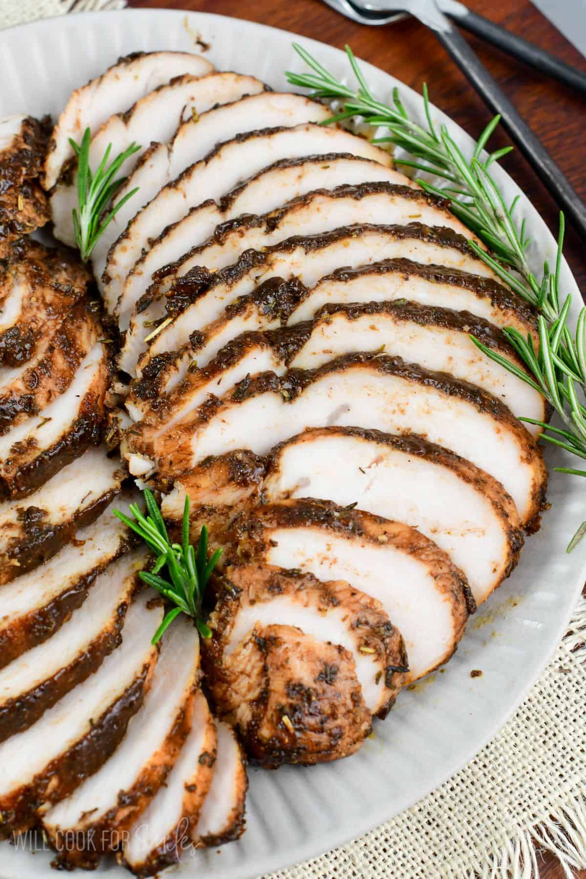 tender and flavorful turkey tenderloin sliced and layered on the platter with balsamic and Italian seasoning coating.
