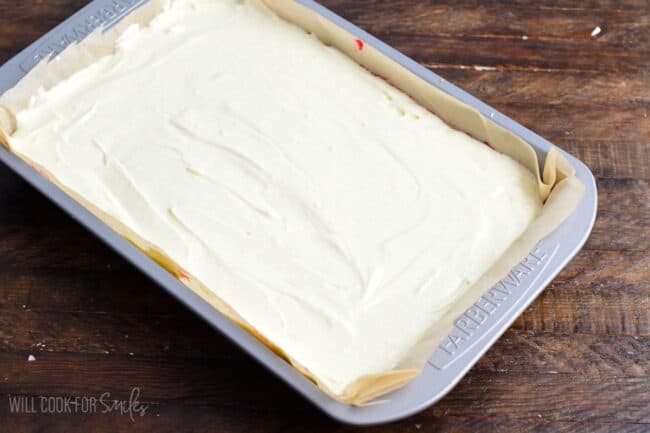Christmas Cheesecake Bars before baking on a wood surface.
