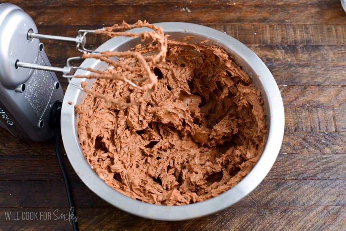 beating in the dark chocolate into the light and fluffy cream cheese mixture.