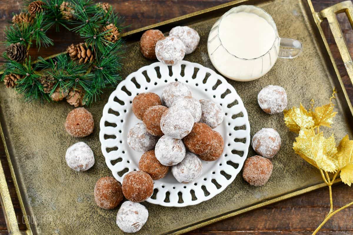 Bite-sized no bake RumChata rum balls arranged on a holiday platter.