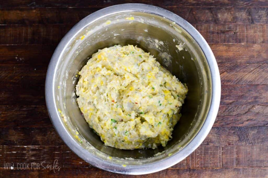 mixed shrimp meatball mixture for the meatballs in a mixing bowl.